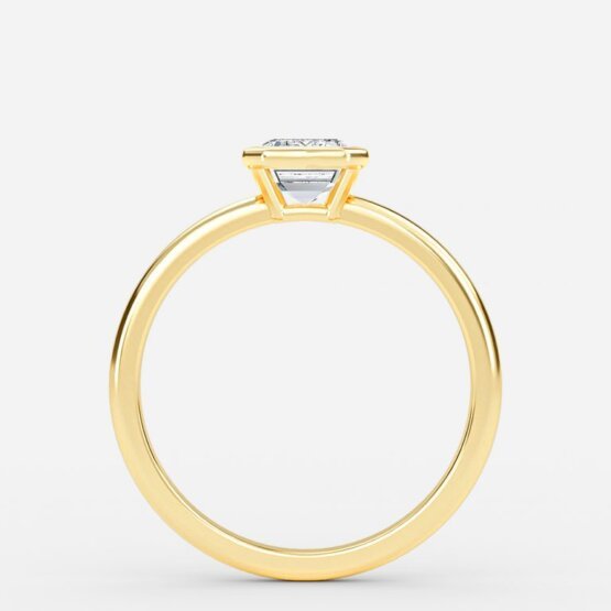 bezel set yellow gold emerald stone ring