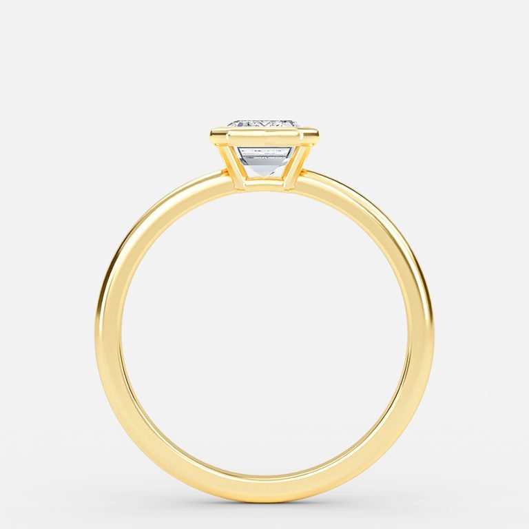 bezel set yellow gold emerald stone ring