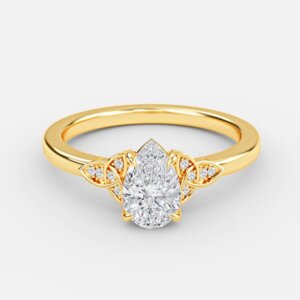 Jolie pear cut yellow gold vintage ring, front view showing petal accent diamonds and ornate basket