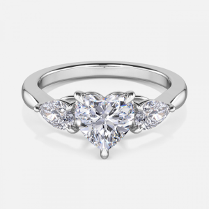 Olina heart cut white gold three stone ring, front view showing inward pear sides embracing heart centre