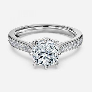 Aria cushion cut white gold vintage ring, front view showing ornate 8-prong crown and channel-set diamond band