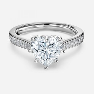 Aria heart cut white gold vintage inspired ring, front view showing ornate prong crown and channel-set diamond band