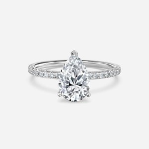Tulip pear cut white gold diamond band ring, front view showing pavé diamond band and four-prong head