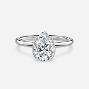 Augusta pear cut white gold bezel ring, front view showing east-west half bezel and plain band