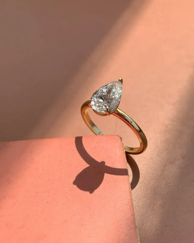 1.77Ct Adriana Pear Solitaire Engagement RingCaptivate with elegance. The 1.77ct Adriana Pear Solitaire in 14K Yellow Gold — a symbol of everlasting love and timeless sophistication(LGDPR-41)#pear #engagementring #ring #diamond #gift #diamondring #ring #pearcut #gold #labgrowndiamond
