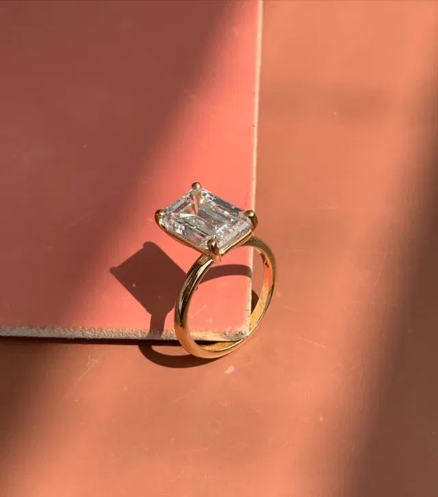 6.02ct Adaya Emerald Solitaire Engagement RingEmbracing forever with this stunning 6.02ct Adaya Emerald Solitaire in 18K Yellow Gold. Its radiant green beauty perfectly symbolizes our eternal love and commitment.(LGDEM-84)#emerald #engagementring #ring #diamond #gift #diamondring #ering #emeraldcut #gold #labgrowndiamond #weddingring